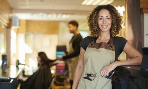 A business owner standing in shop