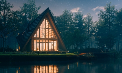 Night time view of a house with the lights on