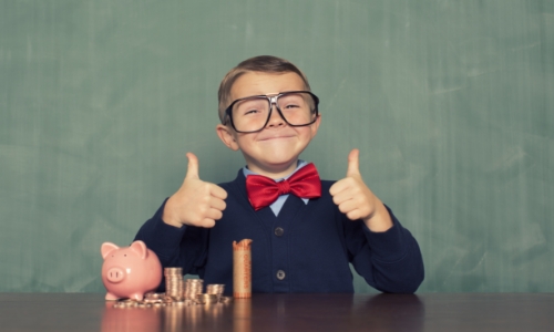 A child saving money in a piggy bank