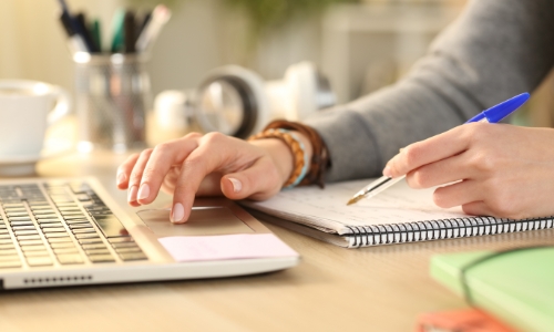 A person filling out financial aid forms online