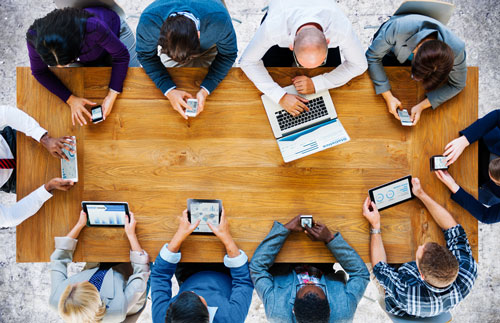 Employees sitting around a table having a meeting