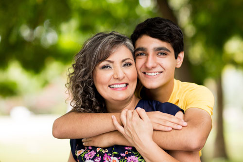 Son and mother hugging each other