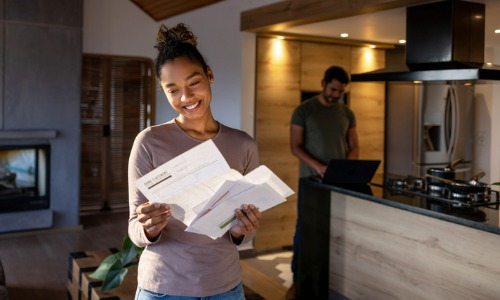 Woman receiving mail in new home