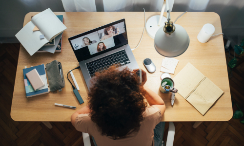 Woman video chatting while working from home