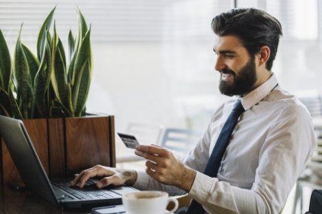 Business owner using credit card to buy items online