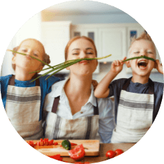 mom and kid having fun preparing food