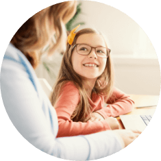 young girl smiling up and mother