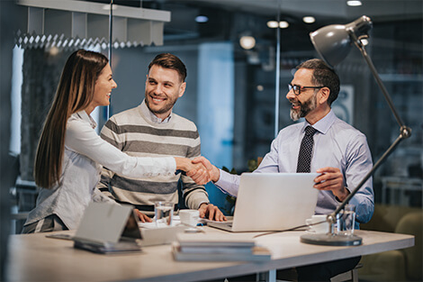 young couple meeting with a commercial lender