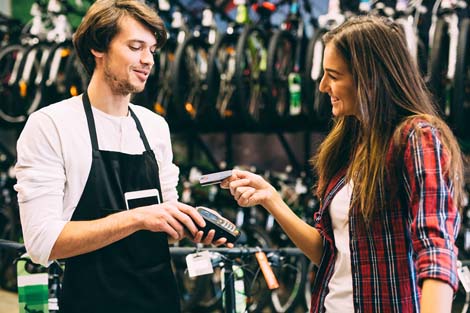 Woman paying for purchase with credit card