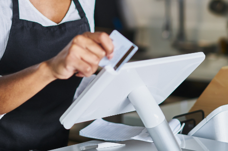 Employee swiping a card