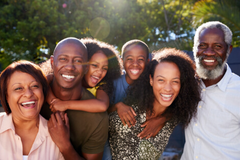 multi generational family smiling 