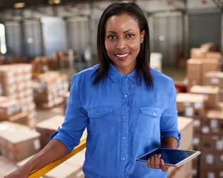 Woman standing in a warehouse